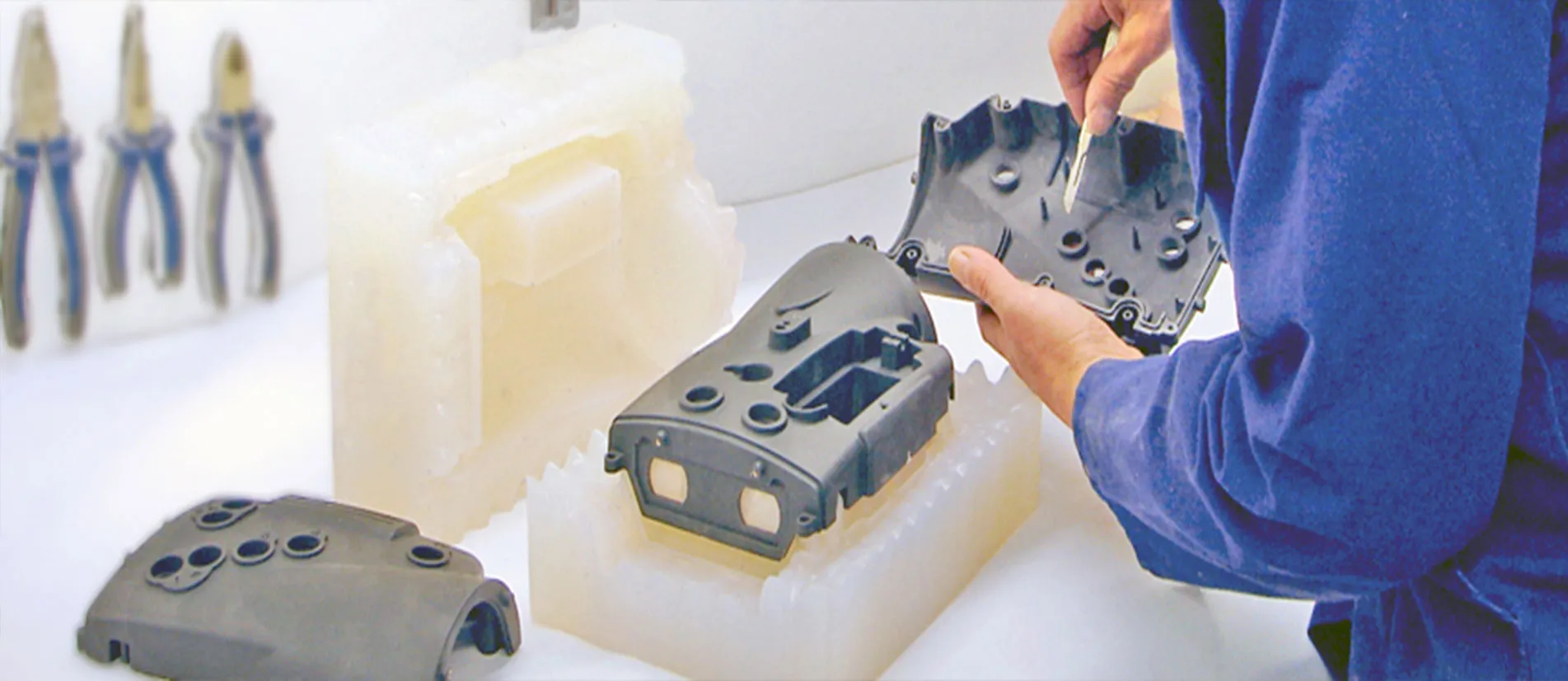Professional vacuum casting equipment and production facility showing silicone molds and polyurethane parts being manufactured with precision casting equipment